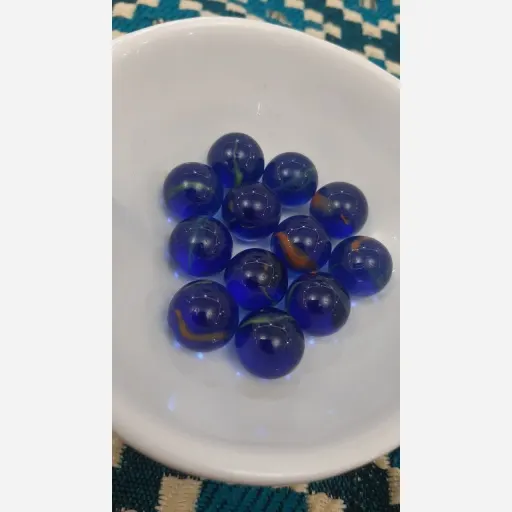 تیله شیشه ای سرمه ای صد عددی 
