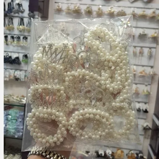 کش مو مرواریدی تاج دار 