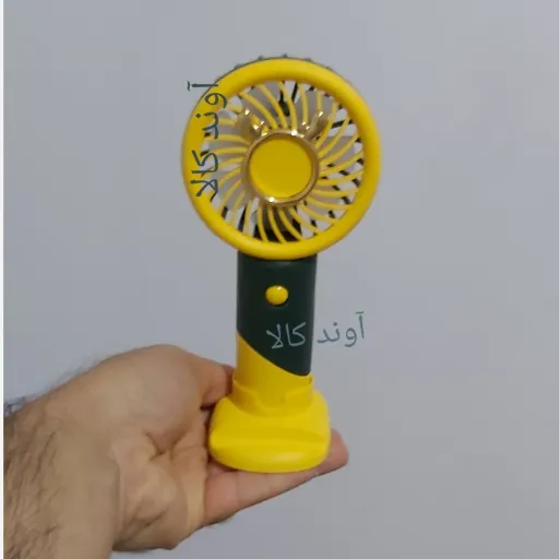پنکه دستی عروسکی دسته دار مینی فن(پنکه دسته دار مسافرتی)پنکه جیبی شارژی. پرتاب خوب رنگ زرد و یشمی