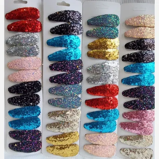 گیره دخترانه تق تقی طرح برجسته تکی رنگ طلایی
